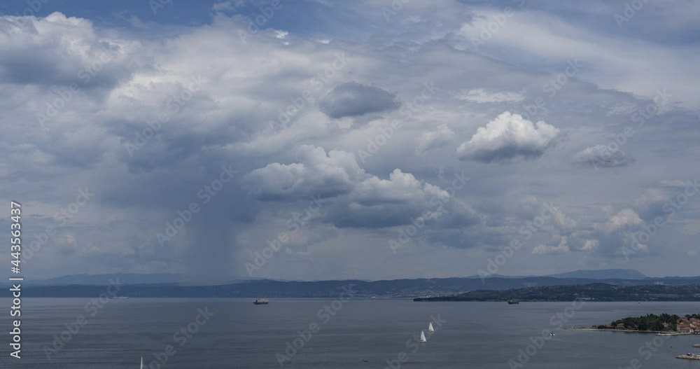 Time lapse of storm clouds moving over Gulf of Trieste. Elevated view of Slovenian and Italian coast. Many sailboats in Adriatic Sea. Summer weather. Static shot, wide angle Time lapse of storm clouds moving over Gulf of Trieste. Elevated view of Slovenian and Italian coast. Many sailboats in Adriatic Sea. Summer weather. Static shot, wide angle