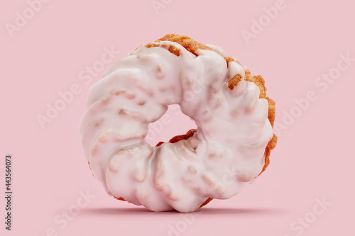 Close up frosted pink cruller donut
