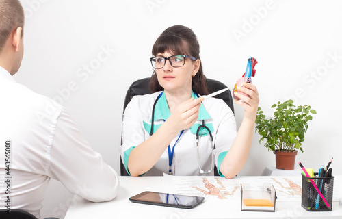 Young patient at the reception of a doctor cardiologist-psychotherapist. The concept of psychological disorder and heart pain, cardiac neurosis, cardiophobia, psychotherapy photo