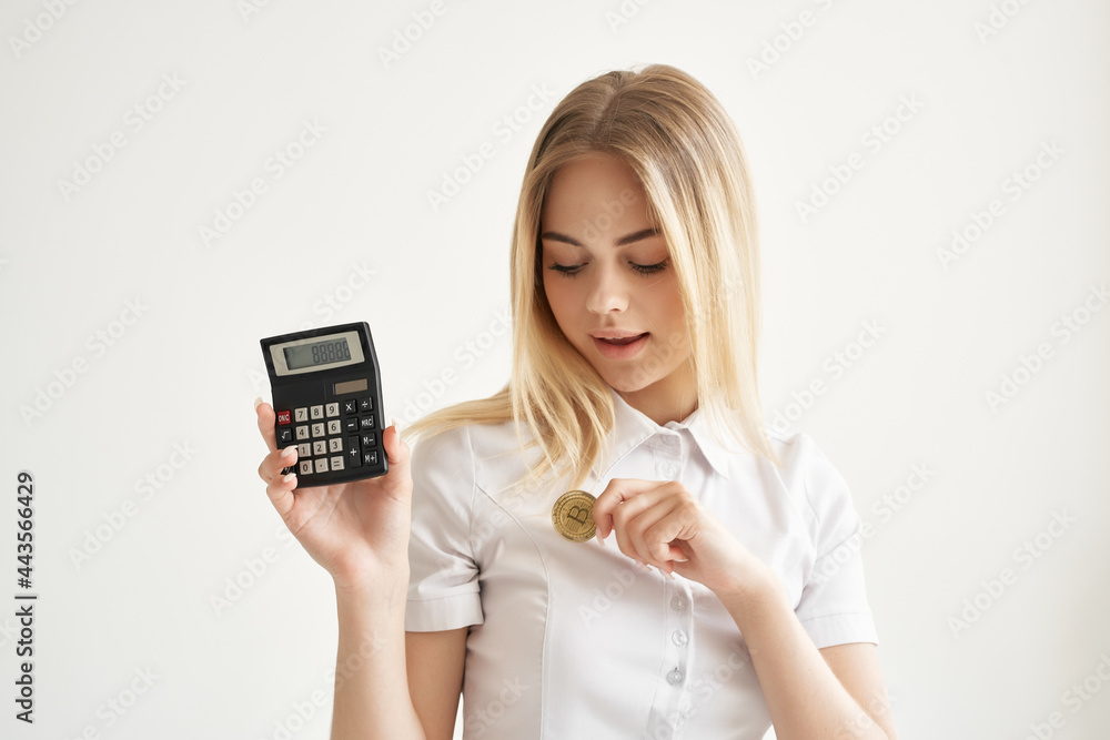 woman in white shirt calculator gold coin cryptocurrency woman in white shirt calculator gold coin cryptocurrency