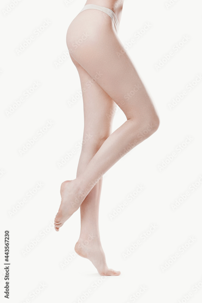 The beautiful girl is having a photo session in the studio in a night dress. The beautiful girl is having a photo session in the studio in a night dress.