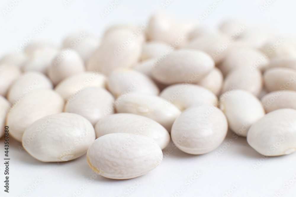 White beans on a white background, isolate, close-up White beans on a white background, isolate, close-up