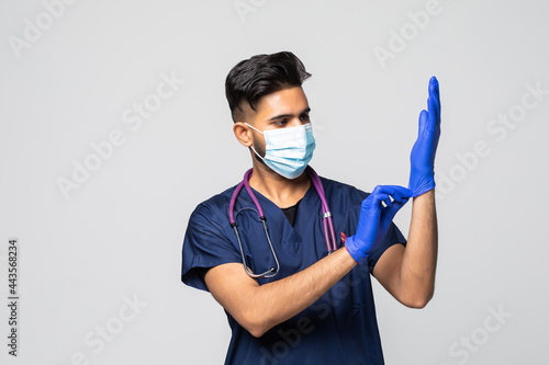 Doctor Puts on Gloves and Wearing Medical Mask. Medical Concept Corona Virus
