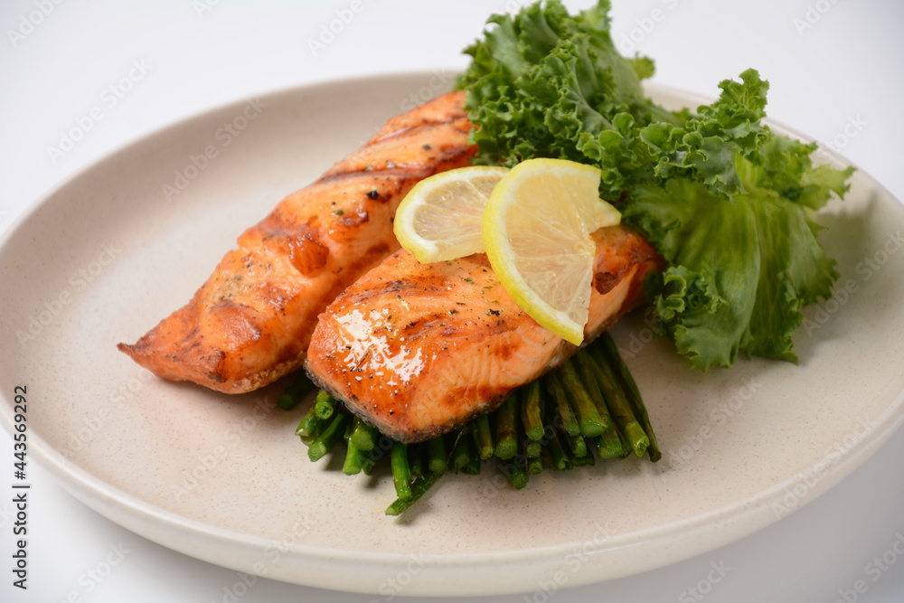 Fried salmon steaks. Cooked salmon steak with pepper, herbs, lemon, garlic, olive oil and Brussels sprouts. Grilled fresh fish. Fried salmon steaks. Cooked salmon steak with pepper, herbs, lemon, garlic, olive oil and Brussels sprouts. Grilled fresh fish.
