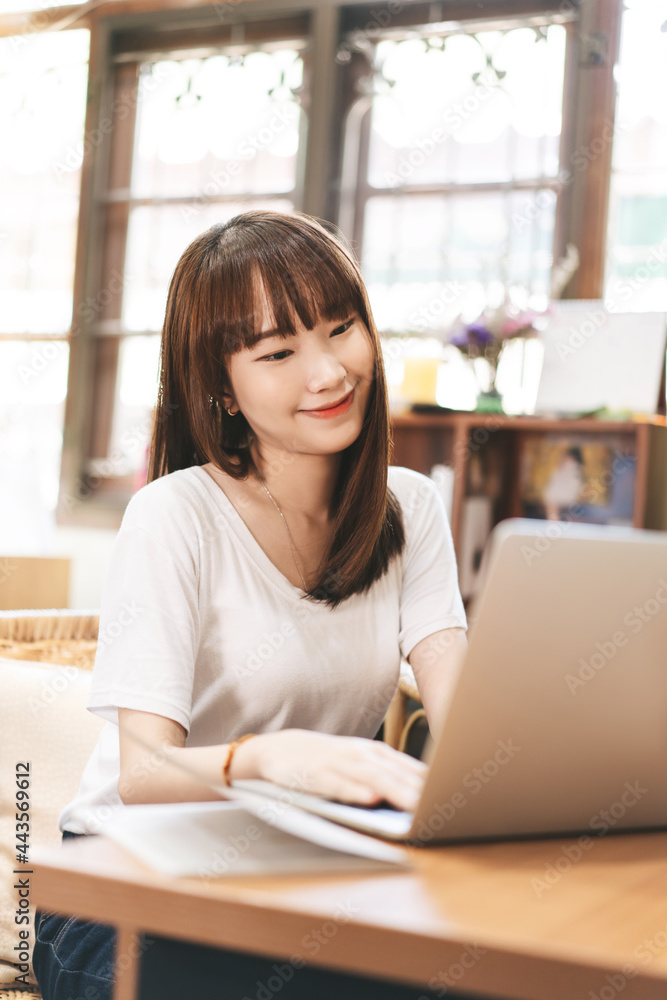 Happy young adult asian student woman study online via internet at home indoor on day. Happy young adult asian student woman study online via internet at home indoor on day.