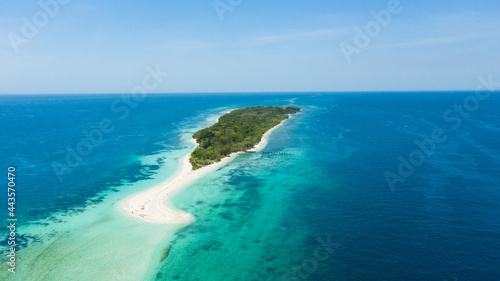 Tropical sandy beach on the island and blue sea. Little Santa Cruz island. Zamboanga, Mindanao, Philippines.