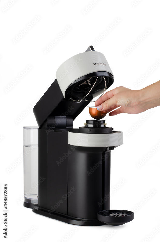 Capsule coffee machine Nespresso with hand is loading capsule Photos |  Adobe Stock