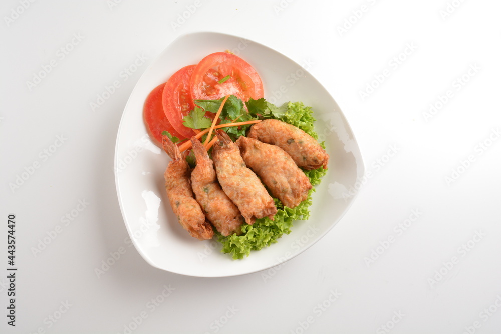 deep fried golden crispy prawn meat ball roll traditional wu Xiang with spicy sauce in white background asian halal snack menu deep fried golden crispy prawn meat ball roll traditional wu Xiang with spicy sauce in white background asian halal snack menu