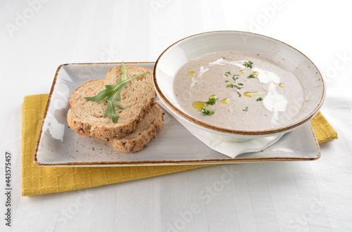 home made hot mushroom thick soup with French toast bread in white background western appetiser halal menu