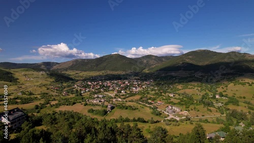 Mountain village of Voskopoja in Albania, surrounded by beautiful hills and green pine forest photo