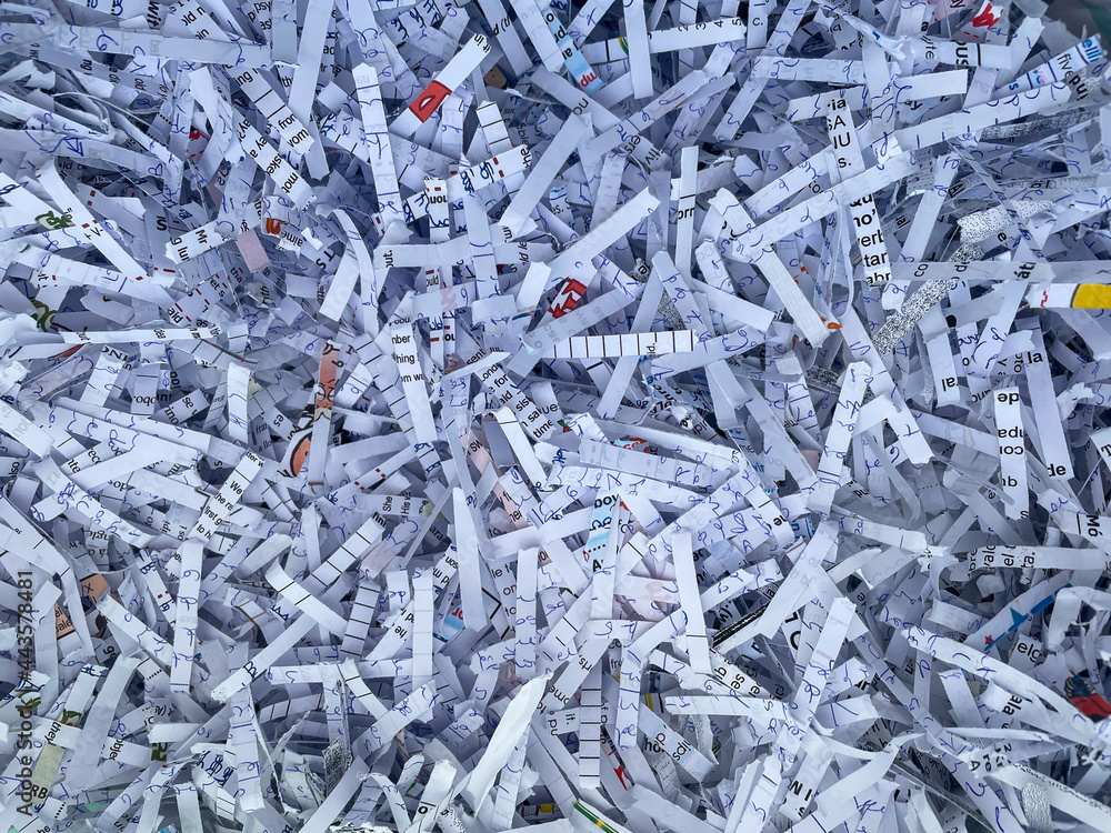 Heap of shredded papers to recycle in an office Heap of shredded papers to recycle in an office