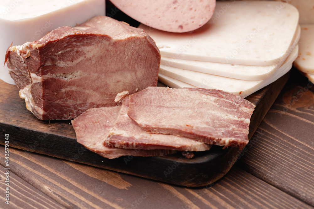 Variety of meat and sausage products on table Variety of meat and sausage products on table