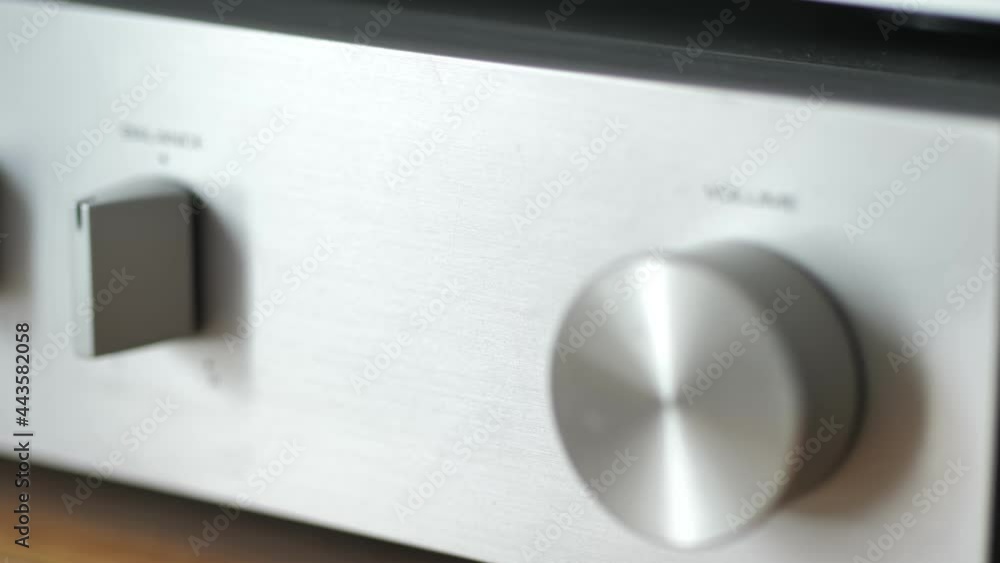 Sound amplifier knobs in close-up, camera panes sideways. Setting the volume, bass, treble and speaker balance. Sound amplifier knobs in close-up, camera panes sideways. Setting the volume, bass, treble and speaker balance.