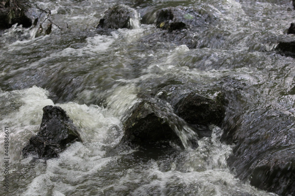 water flowing over rocks water flowing over rocks