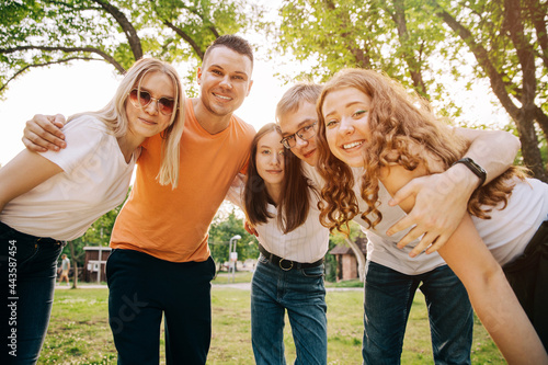 Group of happy young people outdoors in summer
