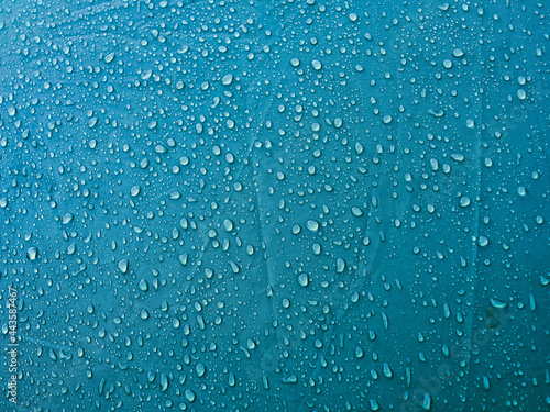 Water drops on waterproof membrane fabric. Morning dew on tent.