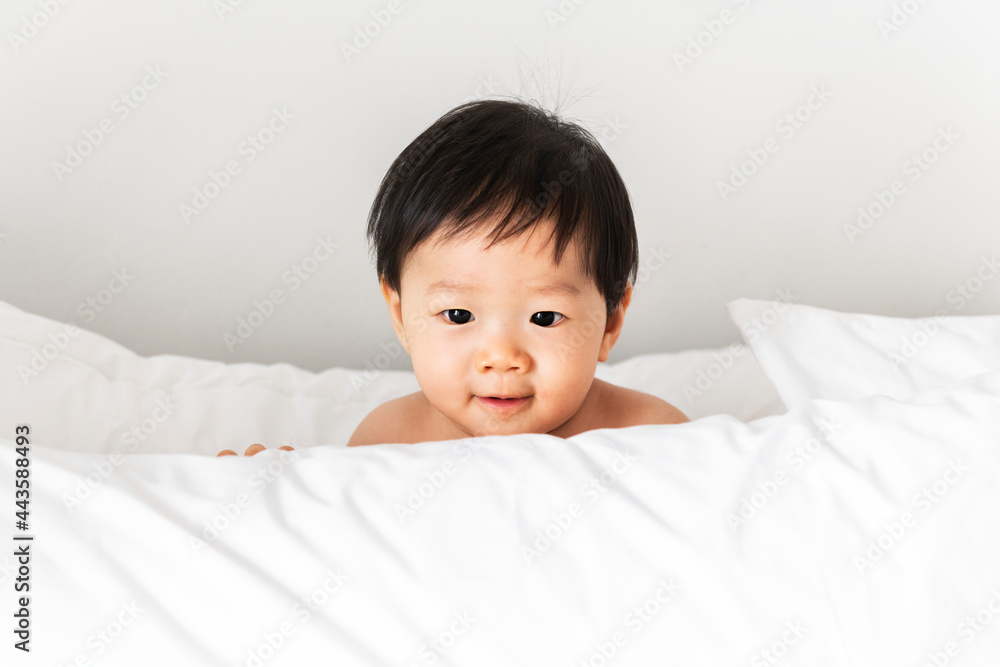 Closeup of a baby playing with a pillow Closeup of a baby playing with a pillow