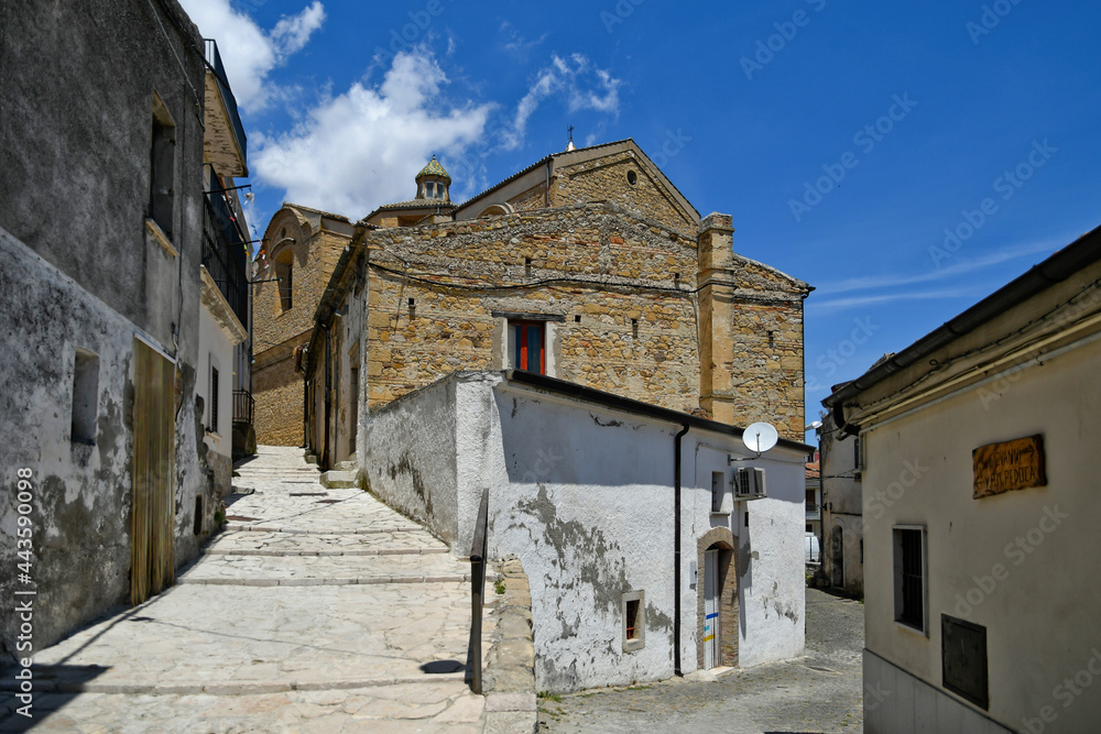 A narrow street between the old houses of  Rocchetta Sant'Antonio, a medieval village in Puglia region, Italy.