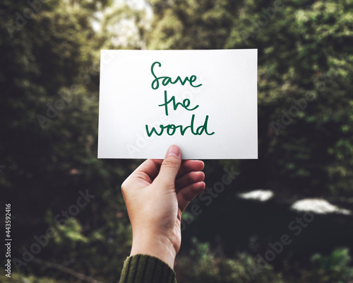 Phrase Save the World in nature background photo