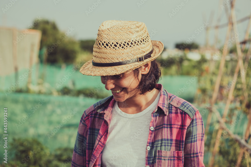 portrait of farmer woman smiling in an orchard