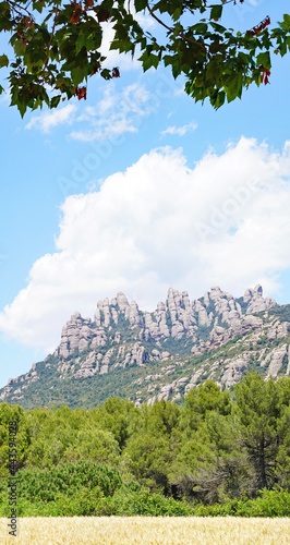 Vista de las montañas de Montserrat con ermita de la salud  desde Collbato en Barcelona, Catalunya, España, Europa
 photo