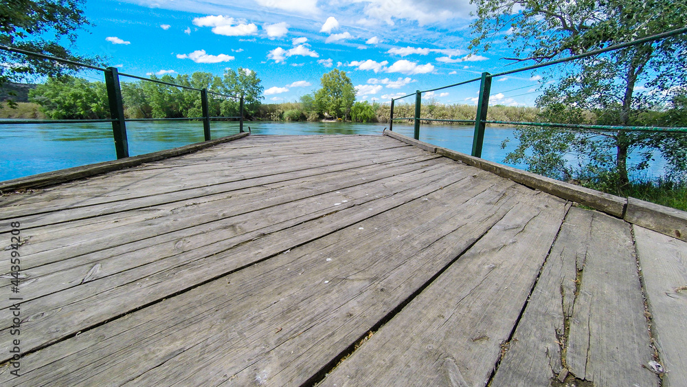 Fototapeta premium aerial views of the ebro river with boats and villages