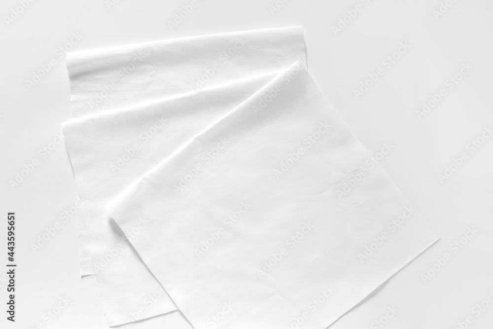 Obraz premium White cotton fabrics swatches on light background. Textile Mockup