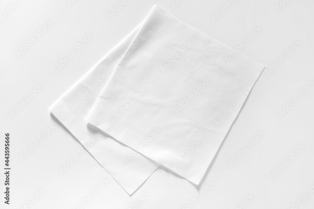 White cotton fabrics swatches on light background. Textile Mockup White cotton fabrics swatches on light background. Textile Mockup