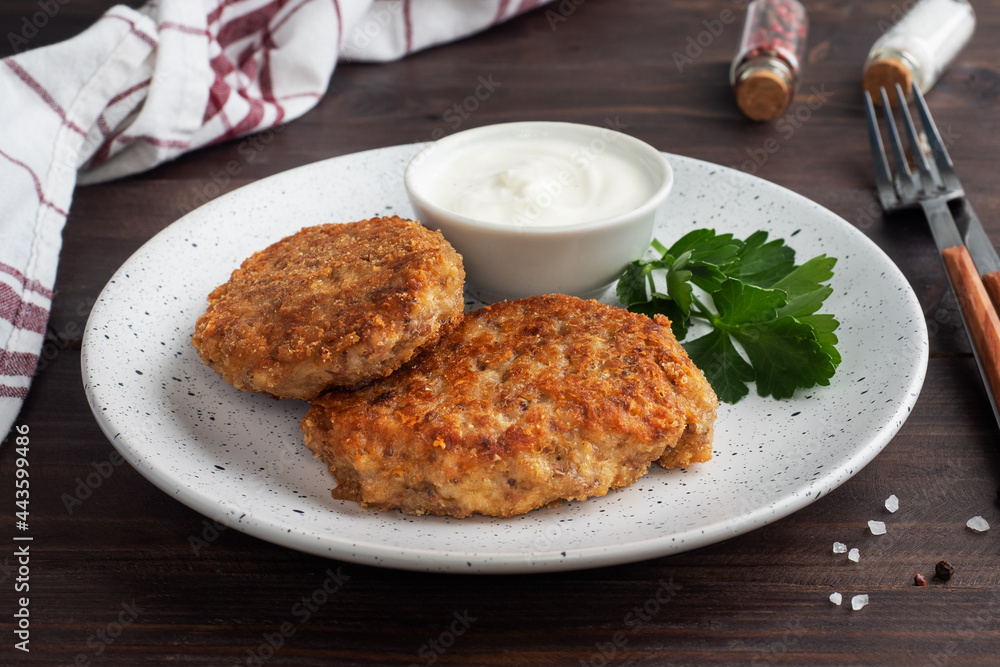 Buckwheat cutlets with cheese and parsley on a plate. Healthy diet food Buckwheat cutlets with cheese and parsley on a plate. Healthy diet food