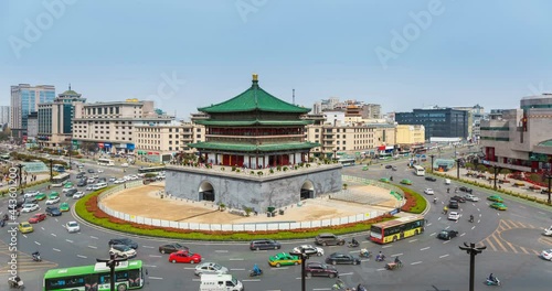 ancient bell tower in daytime with roundabout road traffic stream, time lapse, Xi'an City, Shaanxi Province, China. photo