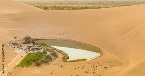 time lapse of the crescent spring, desert landscape at dusk, dunhuang city, gansu province, a famous tourist attraction in China. photo