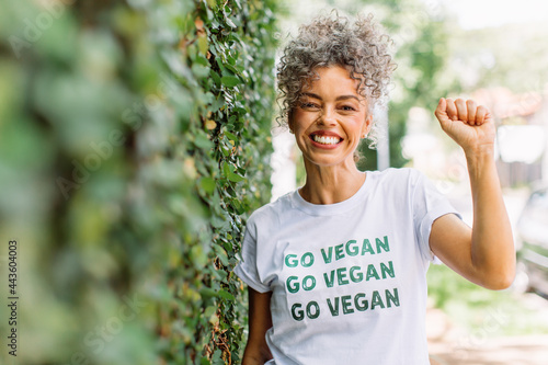 Photo Smiling vegan activist advocating for veganism