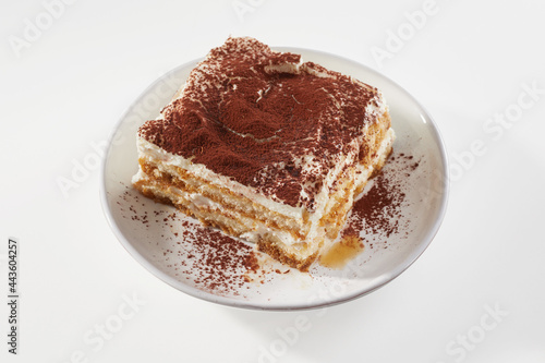 Piece of Tiramisu cake on table