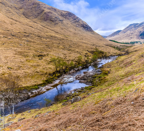 A view down the River Etive at the scenic viewpoint in Glen Etive, Scotland on a summers day