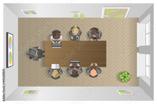 Business meeting in an office Business presentation meeting in an office around a table. Top view.