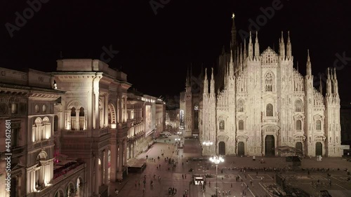 Aerial drone footage of famous statue on cathedral Duomo in Milan Italy by night // no video editing
