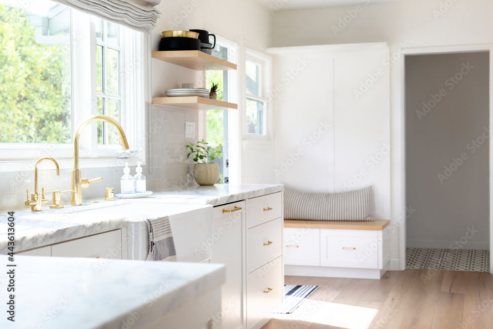 Fototapeta premium Golden kitchen faucet interior design