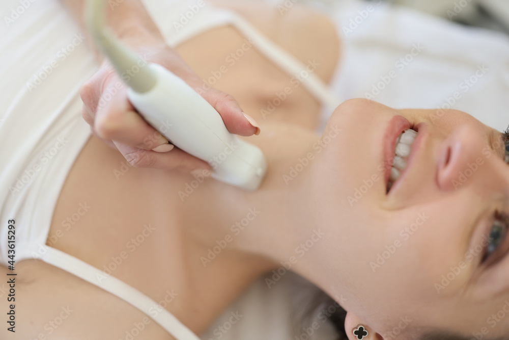 Naklejka premium Professional screening doctor performs examination of thyroid gland