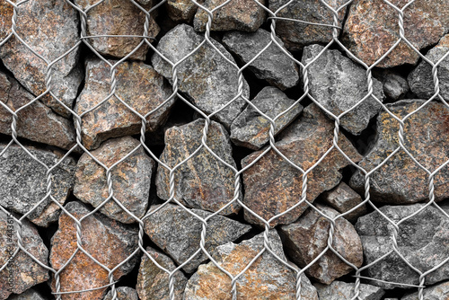 Gabion mesh and stones background wallpaper