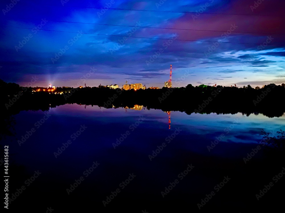 Naklejka premium sunset over the river