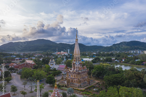 .aerial panorama view scenery sunset above Chalong pagoda in Phuket province..Chalong temple is the one popular landmark in phuket.colorful cloud scape sky sunset.travel culture concept. © Narong Niemhom