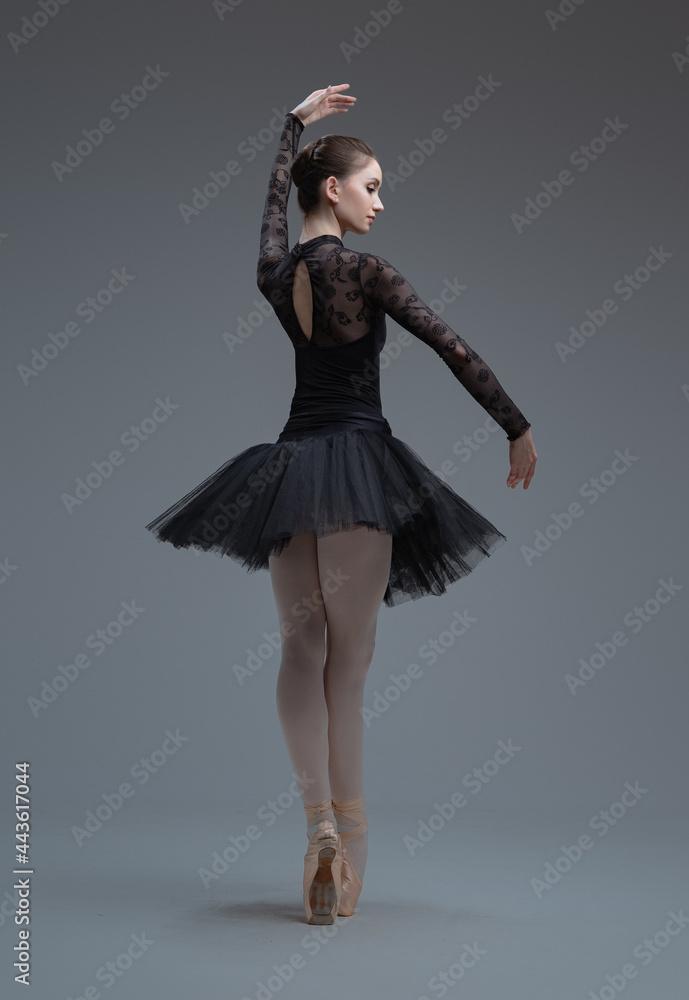 Dancing ballerina dressed in black tutu with skirt Dancing ballerina dressed in black tutu with skirt