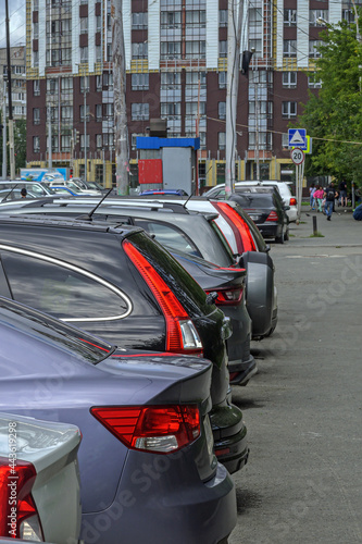 A fragment of a parking lot on a summer day © vladimir subbotin