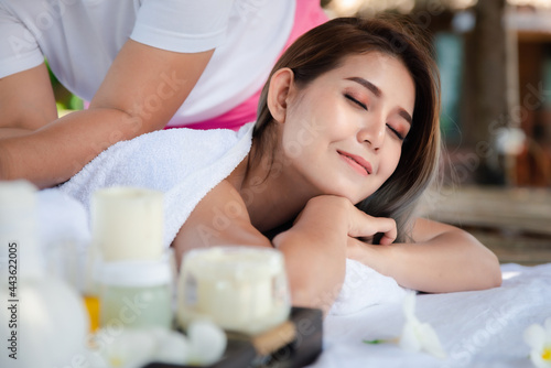 Beautiful asian woman enjoying spa massage therapy