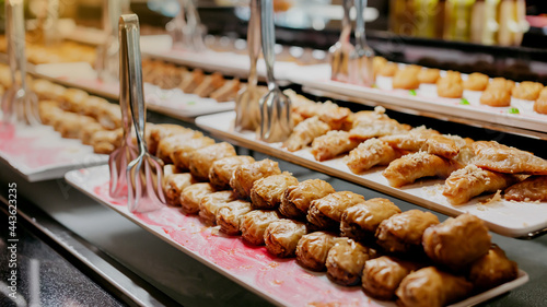 Pieces of Turkish or arabic traditional delicious oriental dessert pahlava, baklava, close up.