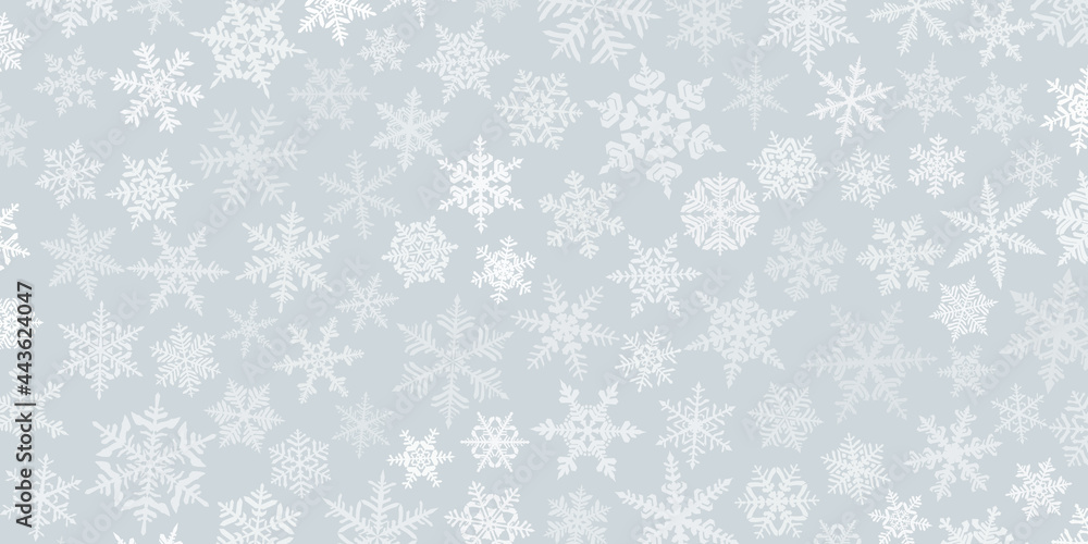 Christmas background with various complex big and small snowflakes, white on gray