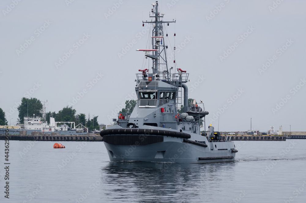 WARSHIP - A tugboat of Polish Navy is maneuvering in the port WARSHIP - A tugboat of Polish Navy is maneuvering in the port
