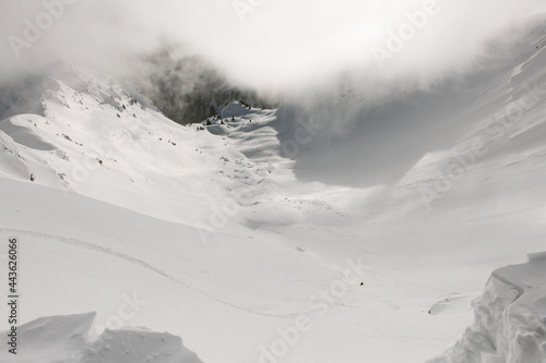 Skitouring with magnificent view of mountains in beautiful winter powder snow.