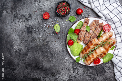 Grilled sausages and meat rolls wrapped bacon, chevapchichi or Kofta kebab. Healthy fats, clean eating for weight loss. banner, menu, recipe place for text, top view