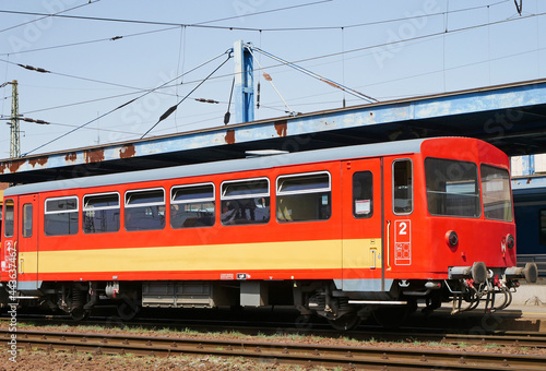 Red passenger carriage at the railway station